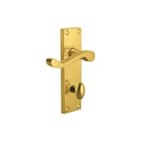 The Polished Brass Victorian Scroll Bathroom Door Handles - 150mm Lever Lock Pair on a white Background 