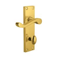 The Polished Brass Victorian Scroll Bathroom Door Handles - 150mm Lever Lock Pair on a white Background 