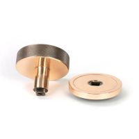 The Polished Bronze Knurled Centre Door Knob on a Plain Rose Displayed in Separate Sections on a White Background The Polished Bronze Knurled Centre Door Knob on a Plain Rose Displayed in Separate Sections on a White Background