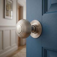 The Polished Nickel Beehive Door Knob Seton a Blue Wooden Door in a Home Corridor - Digital Illustration 