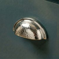 The Polished Nickel Curved Drawer Pull with Hammered Handle Fitted on a Contemporary Kitchen Cupboard Drawer - Digital Illustration The Polished Nickel Curved Drawer Pull with Hammered Handle Fitted on a Contemporary Kitchen Cupboard Drawer - Digital Illustration