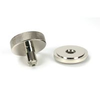 The Polished Nickel Knurled Centre Door Knob on Art Deco Rose Displayed in Separate Sections on a White Background The Polished Nickel Knurled Centre Door Knob on Art Deco Rose Displayed in Separate Sections on a White Background