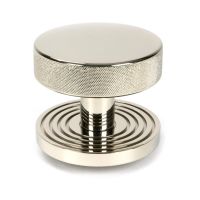 The Polished Nickel Knurled Centre Door Knob on Beehive Rose Shown Upright on a White Background The Polished Nickel Knurled Centre Door Knob on Beehive Rose Shown Upright on a White Background