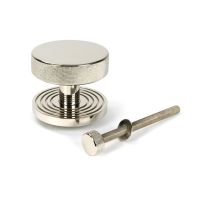 The Polished Nickel Knurled Centre Door Knob on Beehive Rose with Bolt Fitting on a White Background The Polished Nickel Knurled Centre Door Knob on Beehive Rose with Bolt Fitting on a White Background