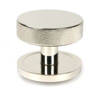 The Polished Nickel Knurled Centre Door Knob on Plain Rose Shown Upright on a White Background The Polished Nickel Knurled Centre Door Knob on Plain Rose Shown Upright on a White Background
