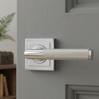 The Polished Nickel Knurled Lever on Square Rose Set on a Light Grey Door in a Modern Living Room - Digital Illustration