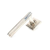 The Polished Nickel Knurled Lever on Square Rose Set on a White Background The Polished Nickel Knurled Lever on Square Rose Set on a White Background