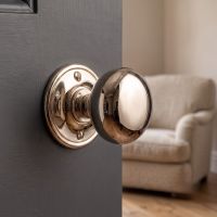 The Polished Nickel Small Mushroom Door Knob Mounted on a Door in a Modern Interior Setting - Digital Illustration The Polished Nickel Small Mushroom Door Knob Mounted on a Door in a Modern Interior Setting - Digital Illustration