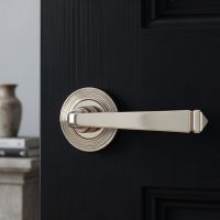 the Polished Nickel Tapered Lever on Beehive Rose Set on a Sleek Black Timber Door in a modern Home - Digital Illustration