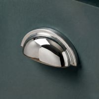 The Polished Nickel Version of the "Stratford" Traditional Cup Handle Mounted on a Wooden Blue Kitchen Cupboard Drawer - Digital Illustration The Polished Nickel Version of the "Stratford" Traditional Cup Handle Mounted on a Wooden Blue Kitchen Cupboard Drawer - Digital Illustration
