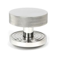 The Polished Stainless Steel Knurled Centre Door Knob on a Beehive Rose Shown Upright on a White Background 