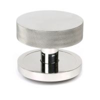 The Polished Stainless Steel Knurled Centre Door Knob on a Plain Rose Shown Upright on a White Background The Polished Stainless Steel Knurled Centre Door Knob on a Plain Rose Shown Upright on a White Background
