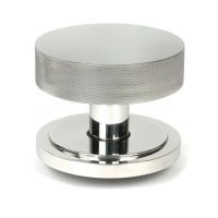 The Polished Stainless Steel Knurled Centre Door Knob on an Art Deco Rose Shown Upright on a White Background The Polished Stainless Steel Knurled Centre Door Knob on an Art Deco Rose Shown Upright on a White Background