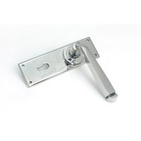 The Polished Stainless Steel Sleek Architectural Lever Lock Door Handle Set on Plain Backplate Shown on its Side The Polished Stainless Steel Sleek Architectural Lever Lock Door Handle Set on Plain Backplate Shown on its Side