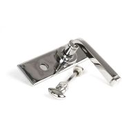 The Polished Stainless Steel Sleek Architectural Privacy Suite Bathroom Lever Handles Shown on its Side The Polished Stainless Steel Sleek Architectural Privacy Suite Bathroom Lever Handles Shown on its Side