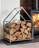 The Polished Steel Contemporary Log Store to the Side of a Log Burner Stove on a Stone Hearth - Digital Illustration The Polished Steel Contemporary Log Store to the Side of a Log Burner Stove on a Stone Hearth - Digital Illustration