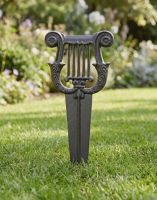 The “Prestonfield” Iron Boot Scraper in Black on a Sunny Grass Lawn - Digital Illustration 