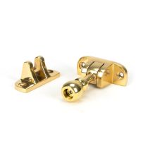 The Radiused Rounded Brighton Sash Window Fastener in Polished Brass on a White Background The Radiused Rounded Brighton Sash Window Fastener in Polished Brass on a White Background