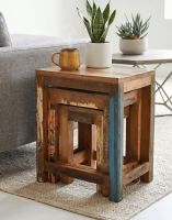 The Recycled Wood Set of Three Nesting Tables next to a Comfy Sofa in a Living Room - Digital Illustration