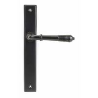The Reeded Slimline Lever Espagnolette Door Latch in Aged Bronze on a White Background The Reeded Slimline Lever Espagnolette Door Latch in Aged Bronze on a White Background