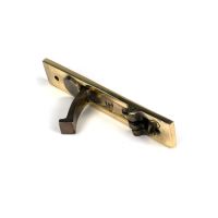 The Retractable Sliding Pocket Door Edge Pull in Aged Brass Shown From Behind