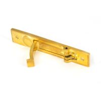 The Retractable Sliding Pocket Door Edge Pull in Polished Brass Shown with Handle Pulled Outwards