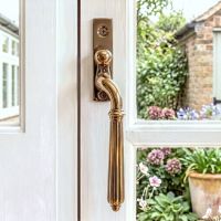 The Right-Handed Polished Bronze Reeded Georgian Espagnolette Window Handle in a Country Home - Digital Illustration The Right-Handed Polished Bronze Reeded Georgian Espagnolette Window Handle in a Country Home - Digital Illustration