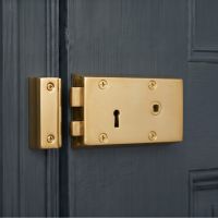 The Right Handed "Veneto" Small Polished Brass Rim Lock Adding Security to a Period Property Home - Digital Illustration