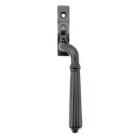 The Right Handed Aged Bronze Reeded Georgian Espagnolette Window Handle on a White Background The Right Handed Aged Bronze Reeded Georgian Espagnolette Window Handle on a White Background