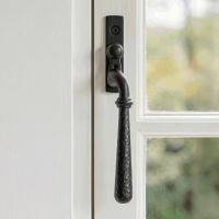 The Left Handed Dark Aged Bronze Hammered Espag Window Handle Mounted on a Traditional White Window Frame in a Country Home - Digital Illustration 
