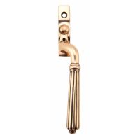 The Right Handed Polished Bronze Reeded Georgian Espagnolette Window Handle on a White Background 