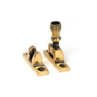 The Rimmed Brighton Sash Square Window Fastener - Aged Brass on a White Background The Rimmed Brighton Sash Square Window Fastener - Aged Brass on a White Background