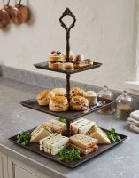 The “Riverhill Park” Rustic Three Tier Cake Stand in a Beautiful Kitchen with a Variety of Cakes and Sandwiches - Digital Illustration The “Riverhill Park” Rustic Three Tier Cake Stand in a Beautiful Kitchen with a Variety of Cakes and Sandwiches - Digital Illustration
