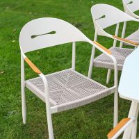 The Riviera 8-Seater Outdoor Dining Set Showing the Curved Chair and Woven Rope Seat