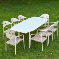 The Riviera 8-Seater Outdoor Dining Set Shown from a High Angle on a Lush Garden Lawn
