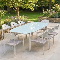 The Riviera 8-Seater Outdoor Dining Set Shown in Golden Sunlight on a Garden Patio - Digital Illustration
