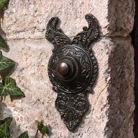 The "Rosemont Hall" Exquisitely Ornate Burnished Copper Bell Push on a Stone Wall by a Front Entrance - Digital Illustration 
