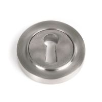 The Round Concealed Standard Keyhole Escutcheon in Satin Stainless Steel Shown on a White Background
