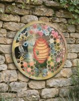 The Rustic Bee Hive Mirrored Garden Wall Art next to Some Plants on an Outdoor Garden Wall - Digital Illustration