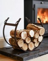 The Rustic Blacksmith Curved Log Rack on a Fireplace Hearth next to a Log Burner in a Country Home - Digital Illustration The Rustic Blacksmith Curved Log Rack on a Fireplace Hearth next to a Log Burner in a Country Home - Digital Illustration
