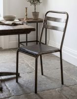 The Rustic Iron Vintage Chair next to a Dining Room Table - Digital Illustration The Rustic Iron Vintage Chair next to a Dining Room Table - Digital Illustration