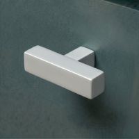 The Polished Nickel "Kodiak" Heavyweight Block T-Bar Cabinet Handle Mounted on a Dark Blue Kitchen Cupboard Drawer - Digital Illustration The Polished Nickel "Kodiak" Heavyweight Block T-Bar Cabinet Handle Mounted on a Dark Blue Kitchen Cupboard Drawer - Digital Illustration