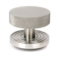 The Satin Stainless Steel Knurled Centre Door Knob on a Beehive Rose Shown Upright on a White Background 
