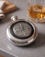 The Saxon Shield Whiskey Flask on a Grey Countertop next to a Tumbler of Whiskey - Digital Illustration The Saxon Shield Whiskey Flask on a Grey Countertop next to a Tumbler of Whiskey - Digital Illustration