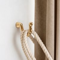 The Scalloped curtain tie back Fitted on a White Painted Living Room Wall - Digital Illustration The Scalloped curtain tie back Fitted on a White Painted Living Room Wall - Digital Illustration