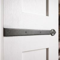 The Simplistic Iron Hinge Front Set on a Brilliant White Coloured Door inside a Contemporary Home - Digital Illustration The Simplistic Iron Hinge Front Set on a Brilliant White Coloured Door inside a Contemporary Home - Digital Illustration
