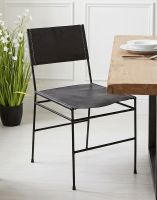 The Simplistic Leather & Iron Dining Chair next to a Solid Wood Dining Table in a Modern Home - Digital Illustration The Simplistic Leather & Iron Dining Chair next to a Solid Wood Dining Table in a Modern Home - Digital Illustration