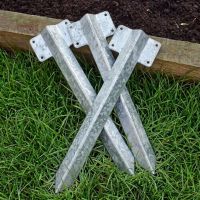 The Single galvanised Railway Sleeper Straight Inline Spikes in Brown next to a Raised Flower Bed