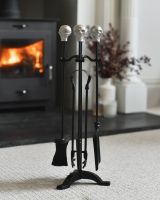 The "Skull Manor" Fireside Companion Set in Front of a Modern Fireplace  - Digital Illustration