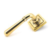 The Slender Classic Reeded Lever on Square Rose Set - Aged Brass on a White Background 